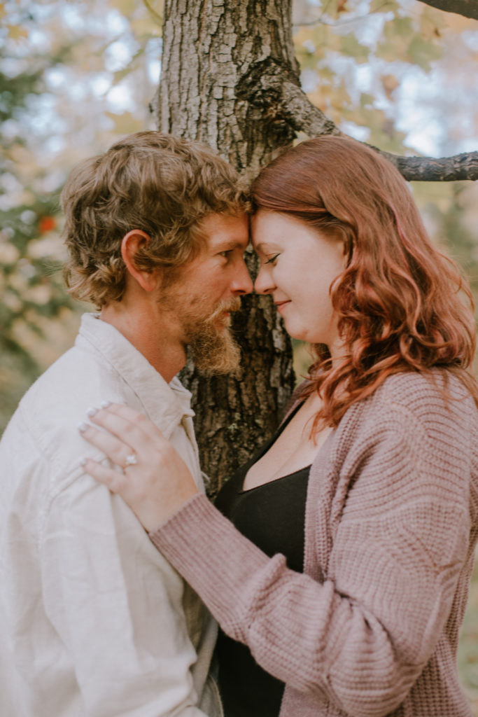 Couple sharing a moment during their fall engagement session.